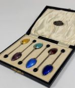 A cased set of six George V silver and enamel coffee spoons, Barker Brothers, Birmingham 1930, the