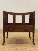 A 19th century mahogany three division Canterbury, fitted with a drawer, raised on slender ring