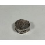 An early 20th century silver pill box, George Bedingham, London import marks for 1904, of shaped