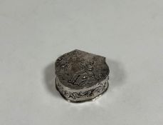 An early 20th century silver pill box, George Bedingham, London import marks for 1904, of shaped