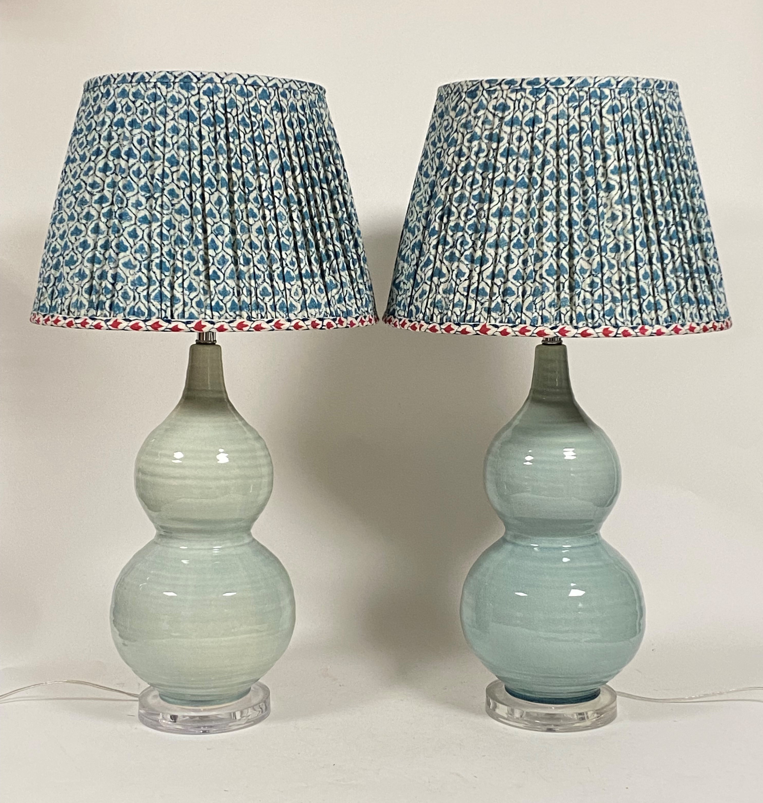 A pair of large OKA "Hulu" double gourd pottery table lamps, in a celadon crackle glaze, with blue