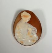 A large 9ct gold shell cameo brooch, oval, carved as a girl with a lamb, the gold mount also with