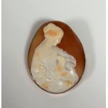 A large 9ct gold shell cameo brooch, oval, carved as a girl with a lamb, the gold mount also with