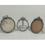 A group of three paste "gem-set" photograph frames, early 20th century, each circular and with