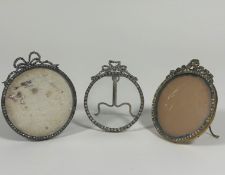 A group of three paste "gem-set" photograph frames, early 20th century, each circular and with