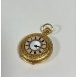 An 18ct gold and engine-turned enamel fob watch, the white enamel dial with Roman numerals and