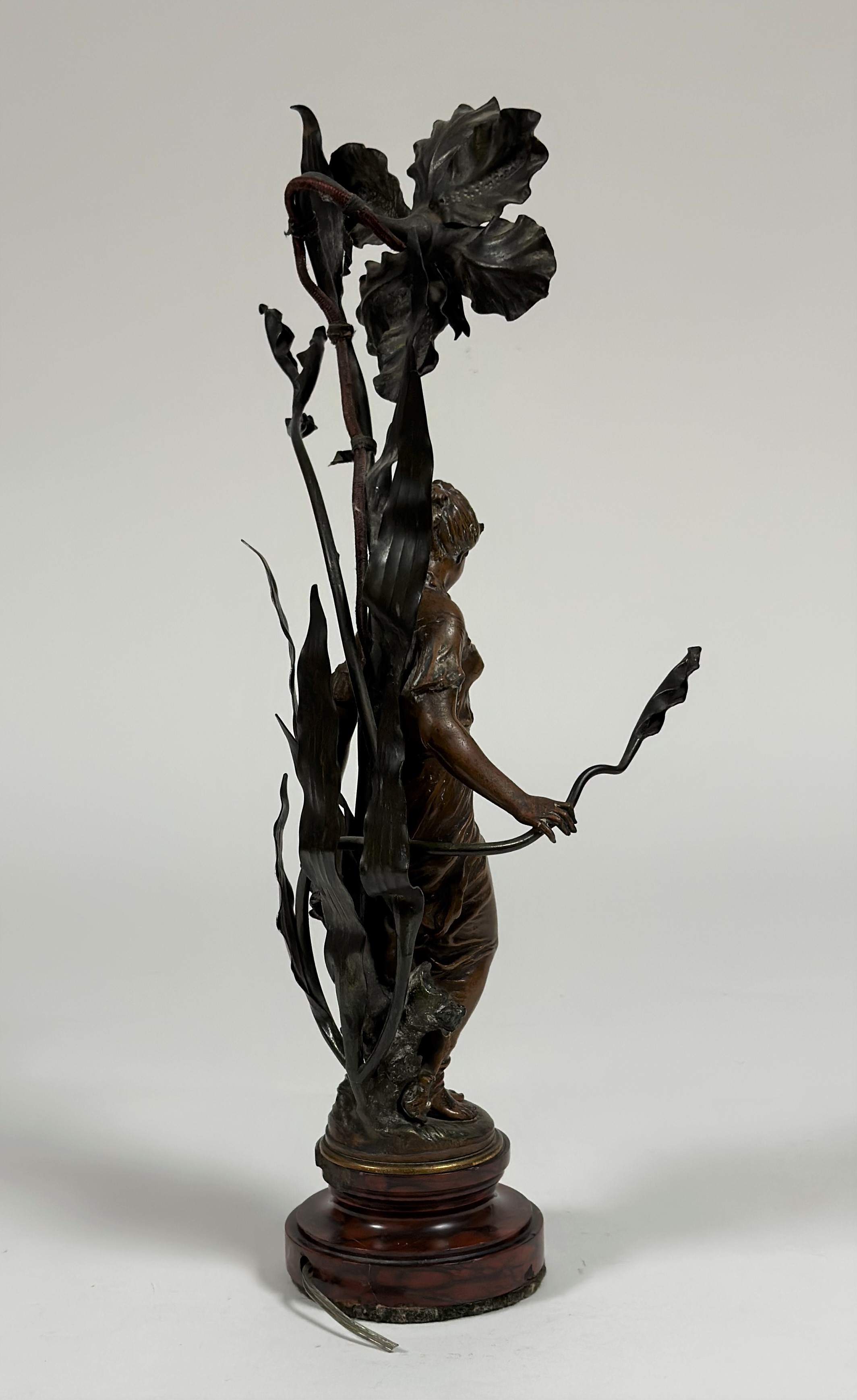 A French spelter figural lamp in the Art Nouveau taste, signed Moreau, modelled as a lady nestled - Image 3 of 3