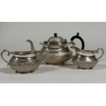 A South-East Asian sterling silver three piece tea service, mid-20th century, each piece of oval