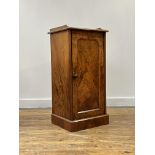 A well figured Victorian walnut bedside cabinet, the 3/4 galleried top over single arch panelled