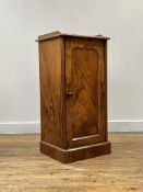 A well figured Victorian walnut bedside cabinet, the 3/4 galleried top over single arch panelled