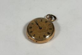 A 14ct gold lady's open face fob watch, c. 1900, the gilt dial with Roman numerals, keyless wind