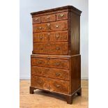 A well figured walnut chest on chest of 18th century design, circa 1920-30, the cavetto moulded