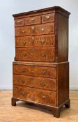 A well figured walnut chest on chest of 18th century design, circa 1920-30, the cavetto moulded