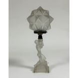 An opalescent glass figural table lamp in the Art Deco taste, the base modelled as a kneeling female