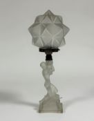An opalescent glass figural table lamp in the Art Deco taste, the base modelled as a kneeling female