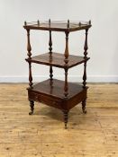 A William IV rosewood whatnot, of three rectangular tiers, the top tier with a brass gallery, on