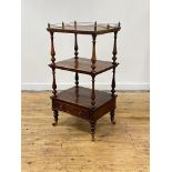 A William IV rosewood whatnot, of three rectangular tiers, the top tier with a brass gallery, on