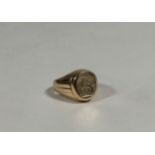 A 14ct gold signet ring, the oval plaque engraved with a crest on a tapering band. Ring size M (