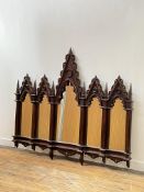 A mahogany framed Gothic Revival overmantel mirror of arcaded sectional form, late 20th century each