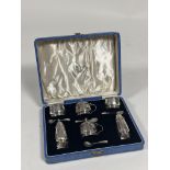 A cased George VI silver condiment set, Davidson, Henderson & Sorley, Birmingham 1939, each piece of