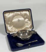 A George V cased silver porringer and spoon, Richard Edgar Stone, London 1934, the bowl with