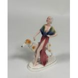 Katzhutte, a German porcelain Art Deco figure of a lady walking a borzoi hound, green printed