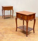 A pair of French cherry serpentine bedside tables, second half of the 20th century, each fitted with
