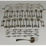 A near complete George V silver flatware service, twelve place settings, Harrods Ltd (R.W.