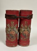 A pair of red canvas shell carrying cases, each emblazoned with the Royal Coat of Arms, bound