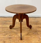 A British Colonial teak table, circa 1900, the circular top over a turned column with chamfered