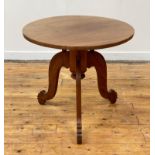 A British Colonial teak table, circa 1900, the circular top over a turned column with chamfered