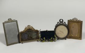 A group of small Edwardian gilt-metal photograph frames comprising: a double aperture frame, the