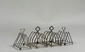 Two pairs of George V silver toast racks, Birmingham 1925 and 1933, each of four divisions. (4)