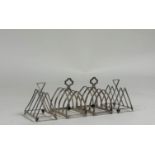 Two pairs of George V silver toast racks, Birmingham 1925 and 1933, each of four divisions. (4)