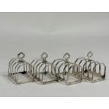 A set of four George V silver toast racks, Sir John Bennett Ltd., London, 1933, of four faceted