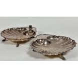 A pair of Epns shell shaped dishes, one with candle holder to top, of scalloped form,