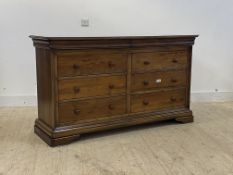 Willis and Gambier, a stained hardwood chest of drawers, the glazed top over two fitted frieze