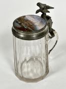 A 19thc German tapered panelled glass tankard with pewter eagle mounted cover with enamelled panel