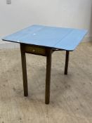 A mid century kitchen table, the blue formica top with drop leaves over drawer to one end, raised on