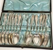 A set of eleven Glasgow Edwardian silver teaspoons with tapered engraved fern leaf handles