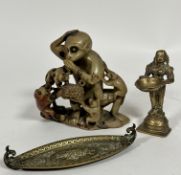 An Indian cast brass standing figure of a goddess with lotus shaped incense holder dish, raised on