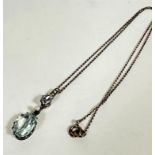 An 830 standard mounted oval aquamarine drop pendant, the lower stone is approximately 3ct with seed