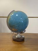 A Vintage illuminated terrestrial globe on a circular stained beech base, H36cm