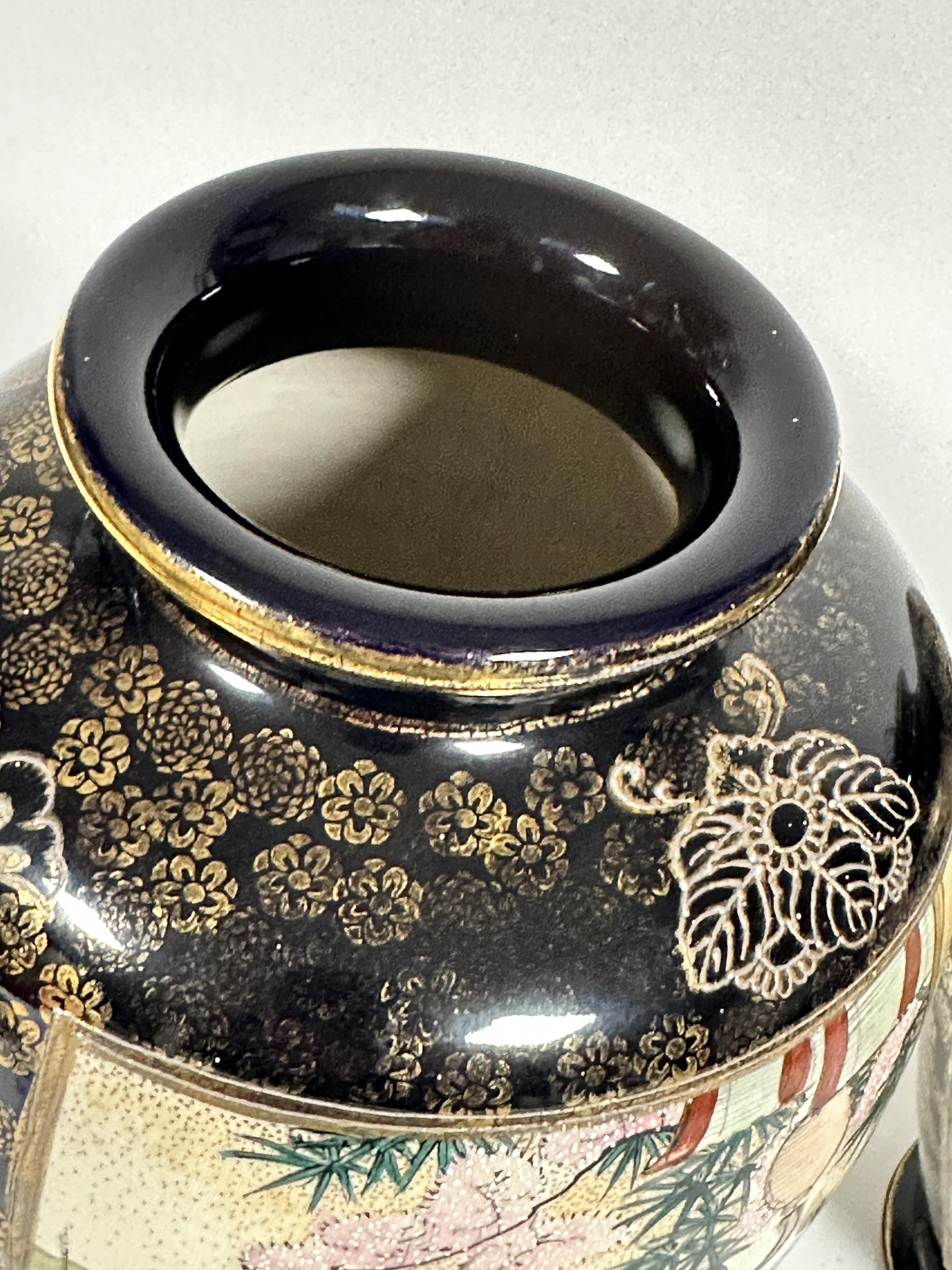 A pair of Japanese Satsuma ovoid tapered vases decorated with scenes in a garden of women playing - Image 4 of 6