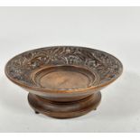 A late 19thc Swiss style treen musical fruit bowl with relief carved border with Edelweiss flowers