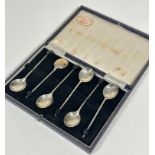 A set of six Birmingham 1964 silver bean handled coffee spoons complete with original case, retailed