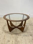 G-Plan, a mid century teak 'Astro' coffee table, the circular top inset with glass panel, raised