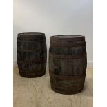 A pair of Coopered oak whisky barrels H90cm, D60cm