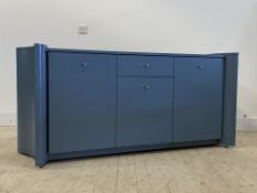A Contemporary blue painted hardwood sideboard of curvilinear outline, fitted with a centre drawer