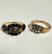 A 19thc yellow metal engraved ring set centre rose cut diamond flanked by surround of six seed